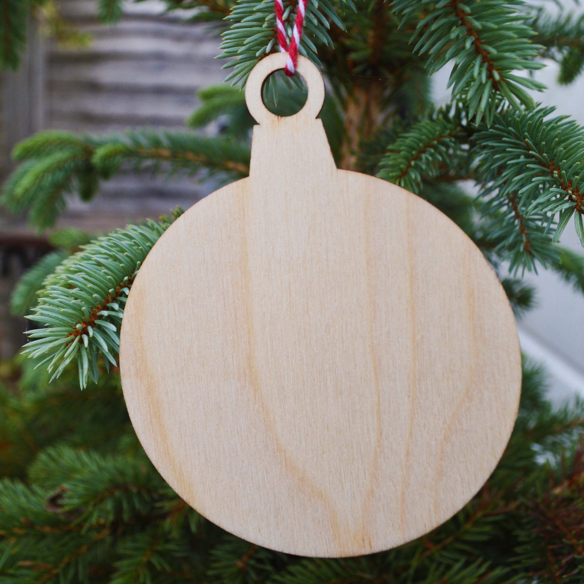 Wooden Bauble on Christmas Tree